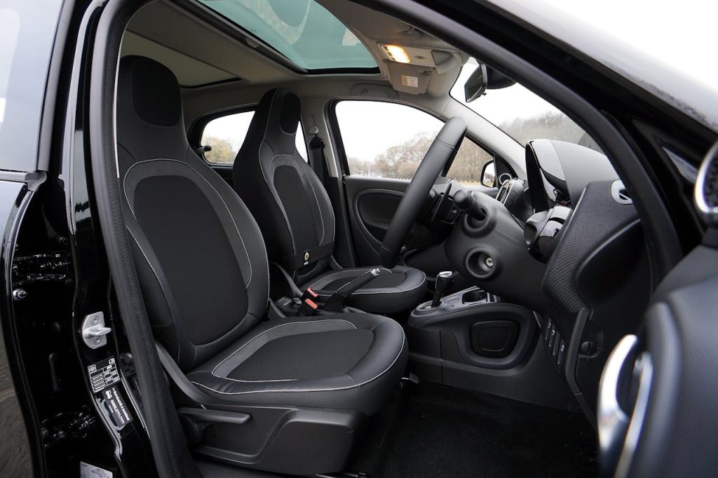 Tuk Tuk Interior Explore a modern car's interior featuring black leather seats and advanced technology.